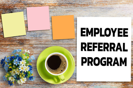 Business quotes, EMPLOYEE REFERRAL PROGRAM on notebook or paper in office desk, office workplace, inspiration, motivation quotes concept.の写真素材