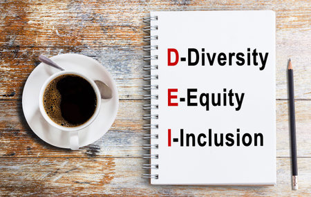 Business quotes, Diversity, Equity, Inclusion on notebook or paper in office desk, office workplace,...