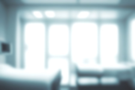 Blur clinic or hospital room, Light blurred background for use. blank hall an office or medical institution hall room. Blur interior background concept.の写真素材