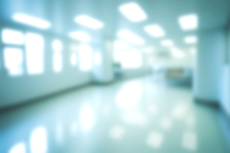 Blur clinic or hospital room, Light blurred background for use. blank hall an office or medical institution hall room. Blur interior background concept.の写真素材
