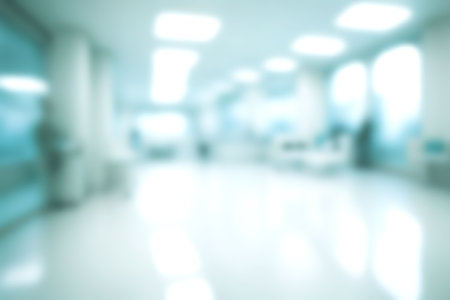 Blur clinic or hospital room, Light blurred background for use. blank hall an office or medical institution hall room. Blur interior background concept.の写真素材