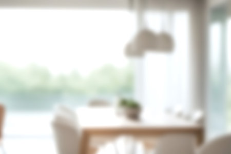 Blur modern dining room at home with soft sunlight at big window for background usage. blur interior background concept. bright tone.の写真素材
