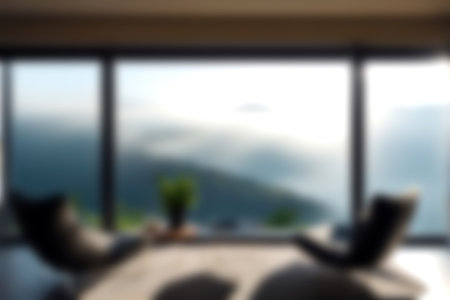 Blur modern livingroom with hill and soft sunlight at big window for background usage. blur interior background concept. white and bright tone. Business concept.の写真素材