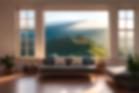 Blur modern livingroom with hill and soft sunlight at big window for background usage. blur interior background concept. white and bright tone. Business concept.の写真素材