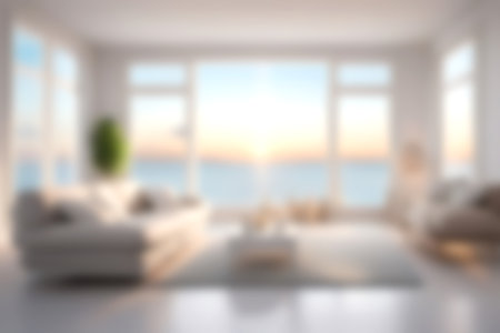 Blur modern livingroom with sea sky and soft sunlight at big window for background usage. blur interior background concept. white and bright tone. Business concept.の写真素材