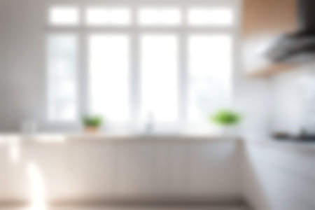 Abstract blurred image of kitchen room with soft light for background usage. Blur interior background concept. white tone.の写真素材