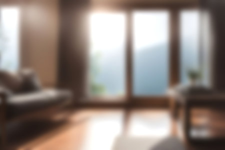 Blur modern livingroom with hill and soft sunlight at big window for background usage. blur interior background concept. white and bright tone. Business concept.の写真素材