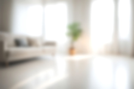 Blur modern livingroom at home with soft sunlight at big window for background usage. blur interior background concept. white and bright tone. Business concept.の写真素材