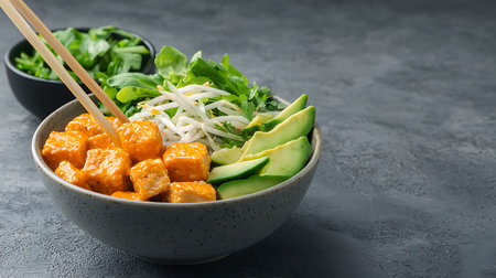 Tofu poke bowl with avocado, cucumber, sesame seeds and arugula