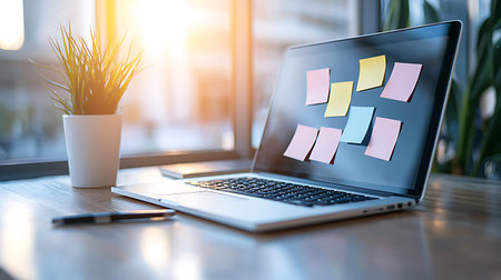 Laptop with sticky notes on the table. Workplace concept.の写真素材