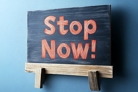 Stop Now - Handwritten on Blackboard, on Blue Background.の写真素材