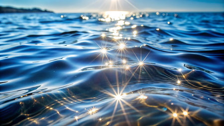 Sunset on the sea. Sea water surface with sunbeamsの写真素材