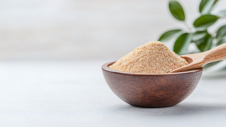 Organic couscous in a wooden bowl on a light backgroundの写真素材