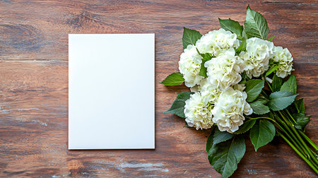 White hydrangea flowers on a wooden background. Flat lay, top view.