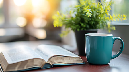 Cup of coffee and book on the table in the morning.の写真素材
