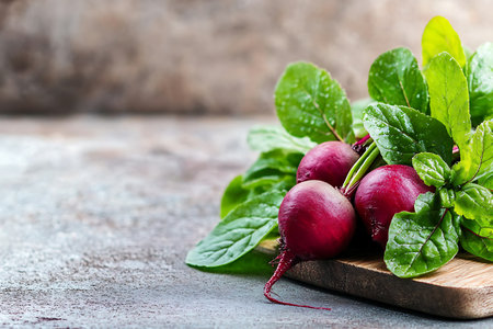 Fresh organic vegetable with green leaves on rustic background. Selective focus.の写真素材