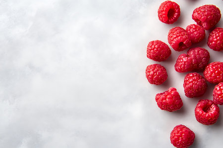 Fresh raspberriesle background. Top view with copy space