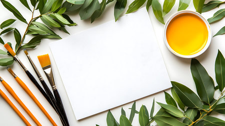 Painting tools and eucalyptus leaves on white backgroundの写真素材