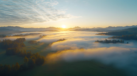 Aerial view of foggy mountain valley at sunrise. Beautiful nature landscape.