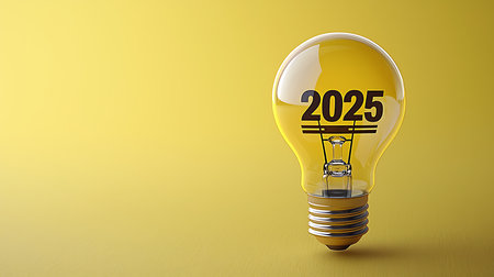 Lightbulb with 2025 text inside on yellow background, 3d renderの写真素材