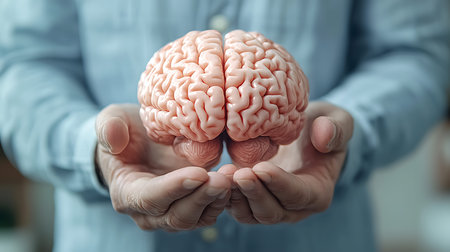 Human brain in the hands of a man close-up. The concept of artificial intelligence.