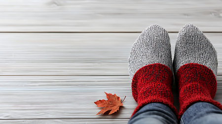 Woman wearing warm socks on wooden background, closeup. Winter clothesの写真素材