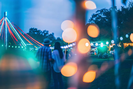 People enjoying a night out in the park at night. Abstract background