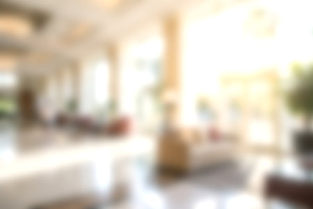 A bright and spacious interior of a modern hotel lobby featuring elegant design elements and a welcoming atmosphere, perfect for both business and leisure travelers.の写真素材