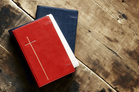 This image features an elegant arrangement of leather-bound notebooks in red and blue with a...