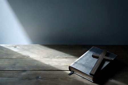 This serene depiction features a bible paired with a wooden cross on a rustic table, illuminated by...
