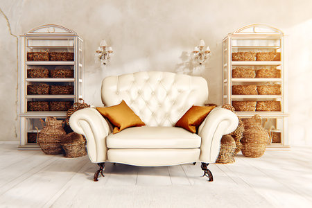 An elegant cream-colored armchair with decorative pillows, nestled in a stylish interior featuring woven baskets, creating a warm and inviting atmosphere.の写真素材