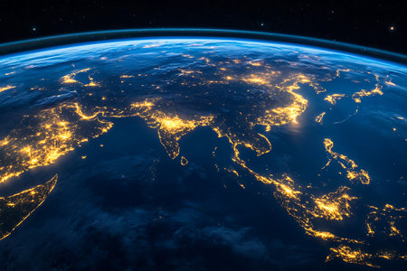 Stunning view of Asia and surrounding regions captured at night, revealing vibrant city lights and...