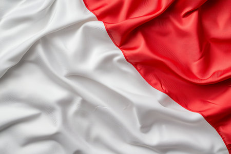 A beautiful representation of the Indonesian flag showcasing rich red and white colors in a flowing silk texture, perfect for symbolism of national pride.の写真素材