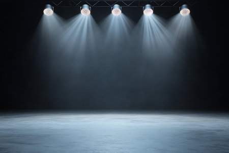 A striking image showcasing four spotlights casting beams of light in a dark, empty stage setting,...