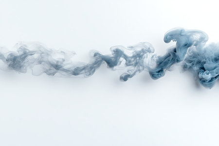 This image features a flowing blue smoke effect on a pristine white background, creating an ethereal and artistic atmosphere perfect for various creative projects.の写真素材