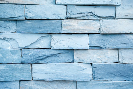 This image showcases a textured blue stone wall, ideal for architectural design projects or decorative purposes. It captures the essence of modern and rustic aesthetics.の写真素材