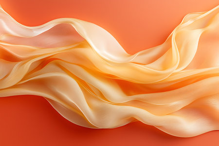 Soft, flowing silk fabric against a vibrant orange background creates a serene and artistic look. Ideal for fashion, design, and decor projects.の写真素材