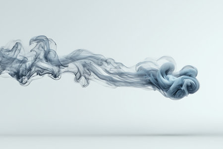 This image showcases an ethereal blue smoke flowing elegantly against a clean white background, creating a serene and artistic display perfect for various creative projects.の写真素材