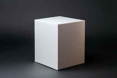 This minimalist white cube on a black background serves as a versatile display for products,...