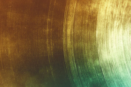 This captivating vintage vinyl record background features warm tones and textured surfaces, perfect...