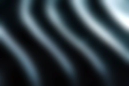 Discover a captivating abstract image featuring smooth waves and curves in contrasting black and white tones. Ideal for modern design themes.の写真素材