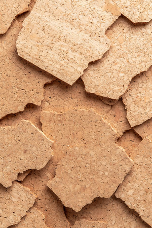 Detailed close-up of natural cork sheets showcasing unique texture and color, perfect for creative...