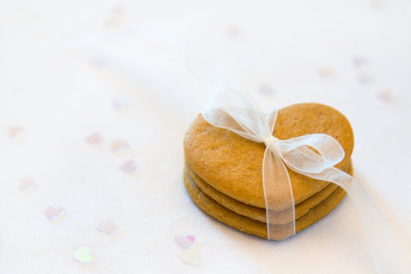Gingerbread hearts tied with a white organza ribbon