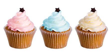 Row of cupcakes decorated with colored frostingの写真素材