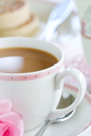 Tea and crumpets, served with a single roseの写真素材