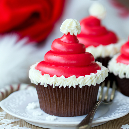 Cupcakes decorated with buttercream santa hatsの写真素材