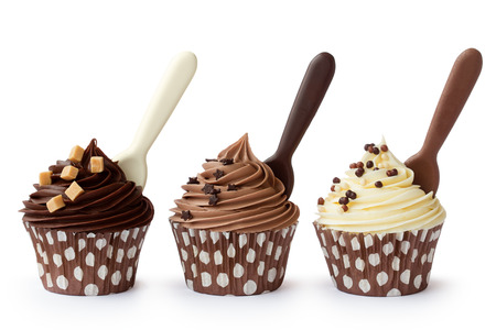 Cupcakes decorated with white, milk and dark chocolate frosting