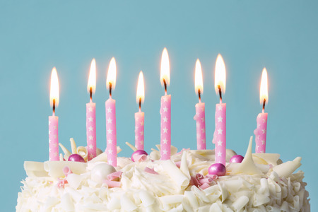 Birthday cake with pink candlesの写真素材
