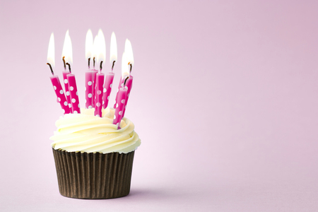 Cupcake decorated with birthday candlesの写真素材