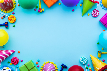 Birthday party background with party hats and candyの写真素材